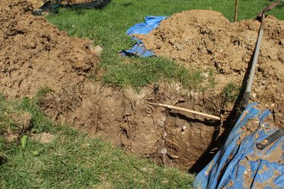 Excavated septic line showing clay soil conditions typical of Tehachapi mountain properties