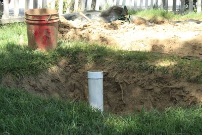 Septic system PVC riser pipe exposed during excavation work on a Tehachapi residential property